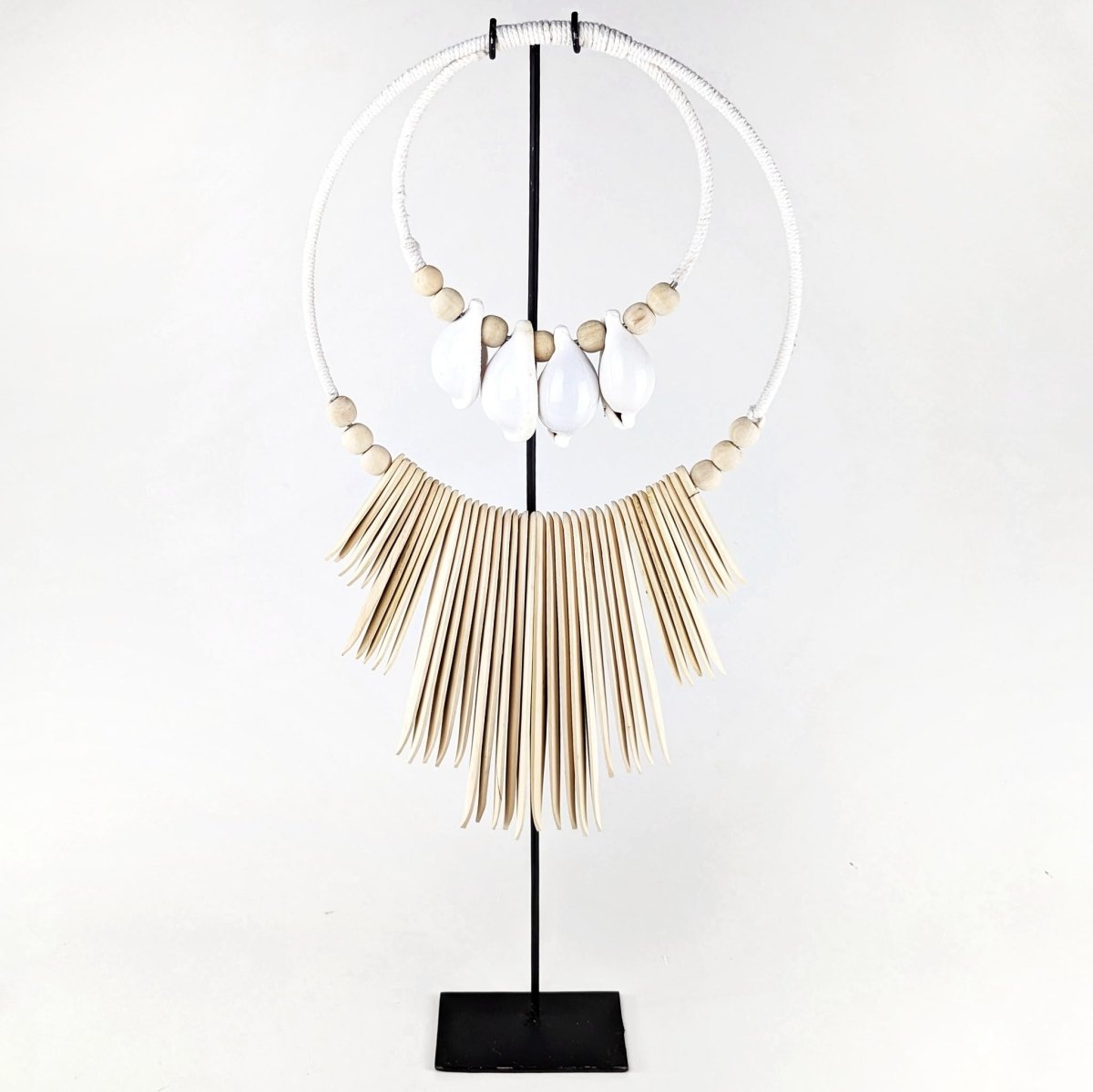 Cuttlefish Shell Necklace. Handcrafted from natural shells, this necklace is a perfect ocean-inspired accessory.