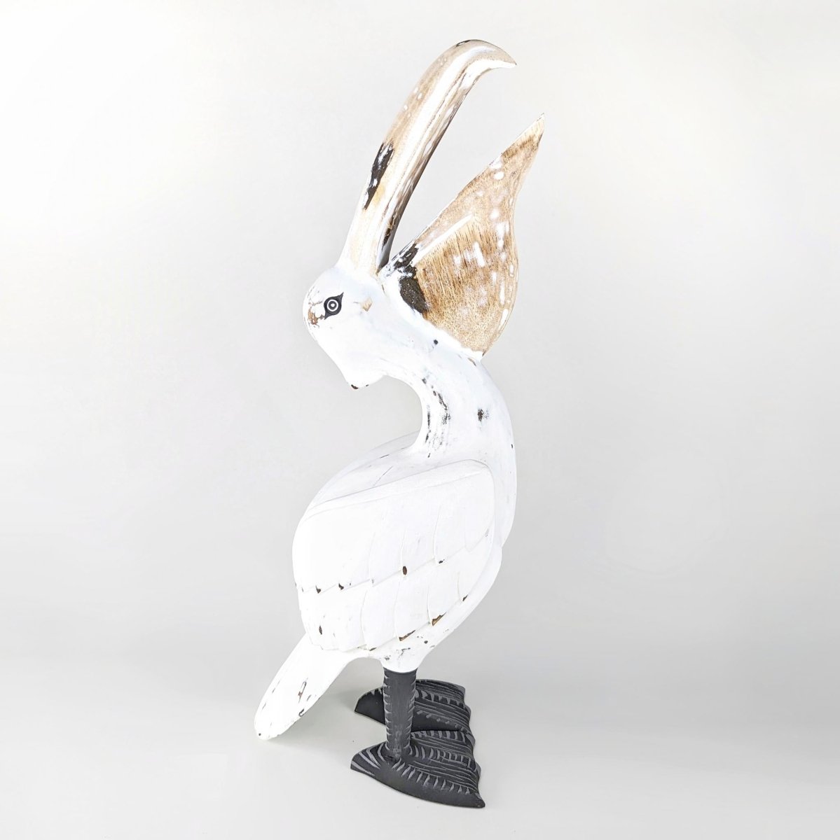 large wooden pelican statue sculpture
