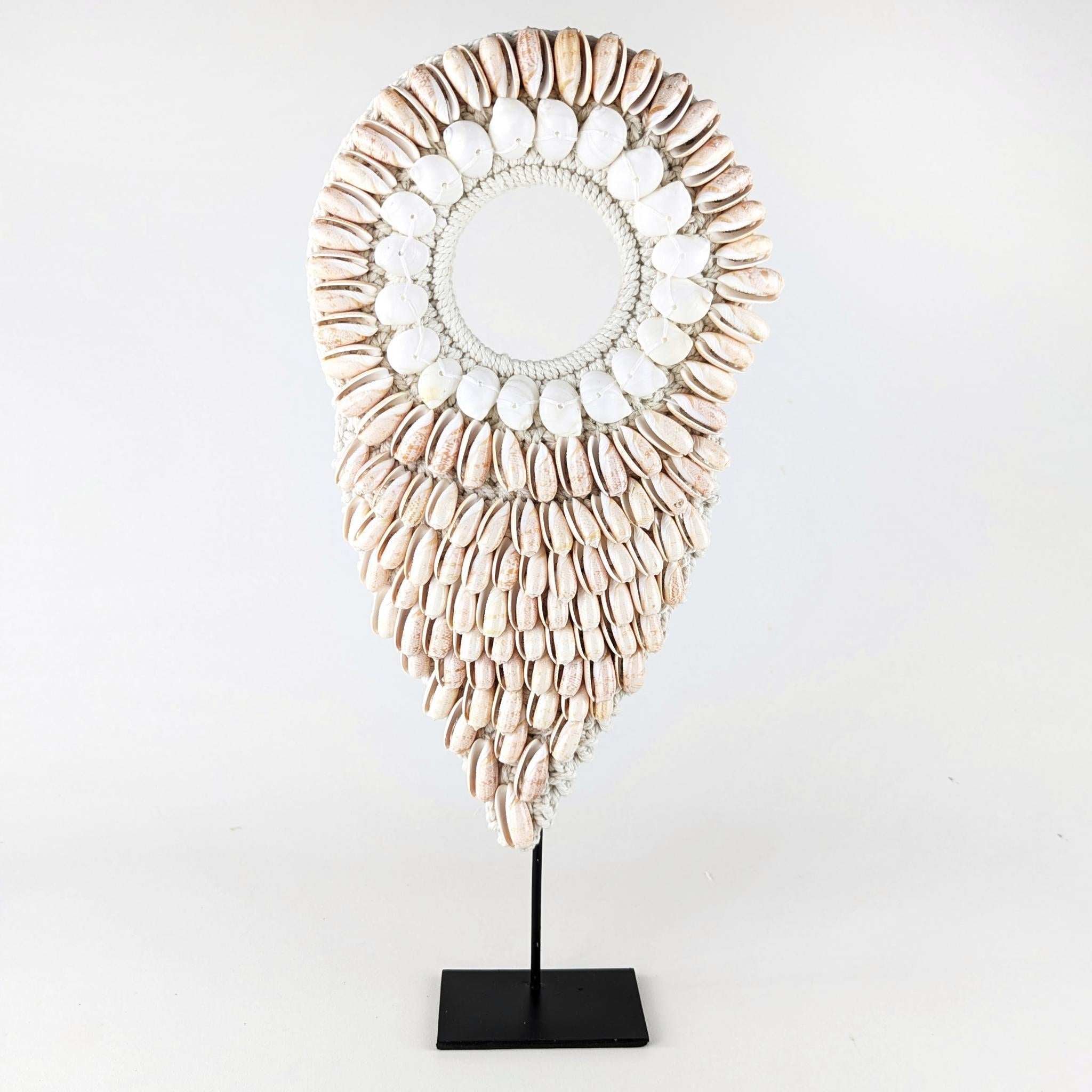 Shell necklace. Handcrafted with shells from Indonesia, it is a perfect addition to your coastal home.